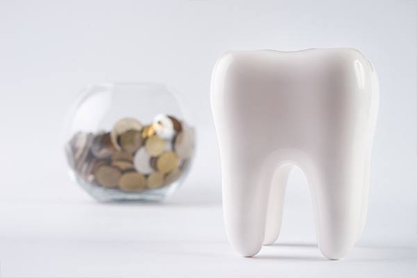 Tooth with coin bank