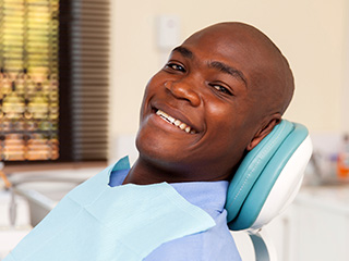 Smiling man in dental chair