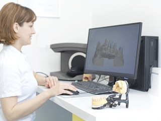 Dental professional using digital scan to design prosthetic