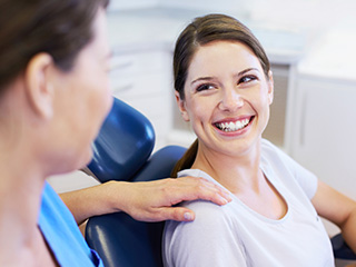 Smiling woman in dental chair