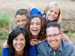 Famil smiling together outdoors