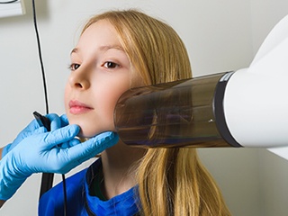 Young girl receiving dental x-rays