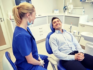 man smiling at his dentist