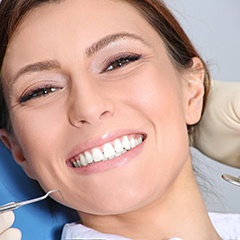 woman smiling in the dental chair