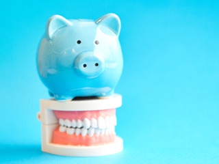 piggy bank helping with cost of emergency dentistry in Edison