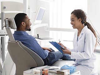 Edison dentist discussing gum disease treatment plans with patient