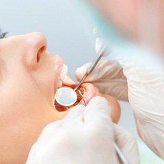 Implant dentist in Edison performing a dental exam