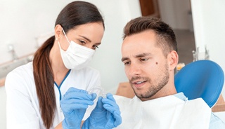 Man at dentist getting Invisalign in Edison