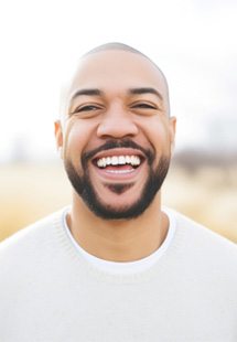Man smiling outside