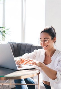 Woman smiling while working at home