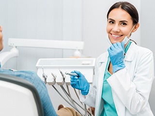 Dentist smiling at patient's dental exam