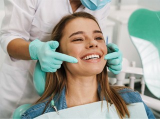 a patient with their tooth-colored fillings in Edison