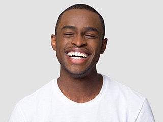 a man smiling after undergoing teeth whitening in Edison