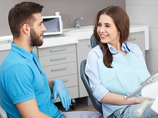 a patient discussing teeth whitening with her cosmetic dentist