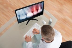 A dentist on the computer.