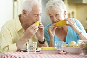 older couple enjoying eating summer foods