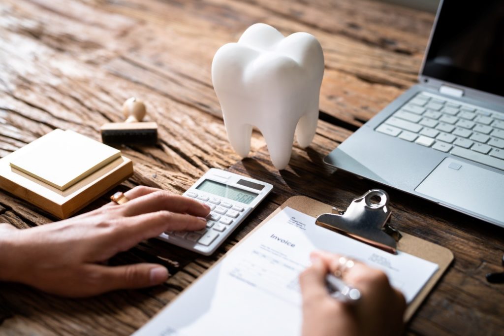 Patient working on dental insurance paperwork