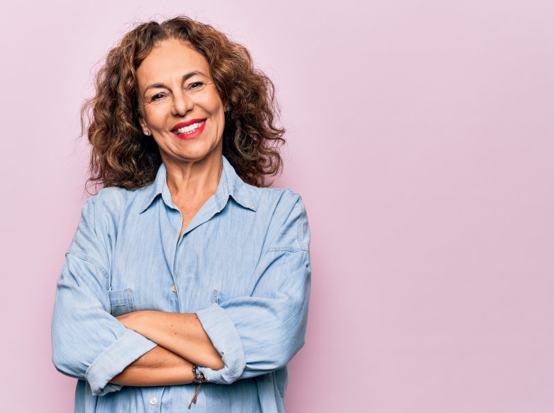 woman crossing arms and smiling