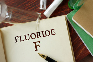 Open book with the words “Fluoride F”