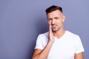 Man with a sensitive dental implant
